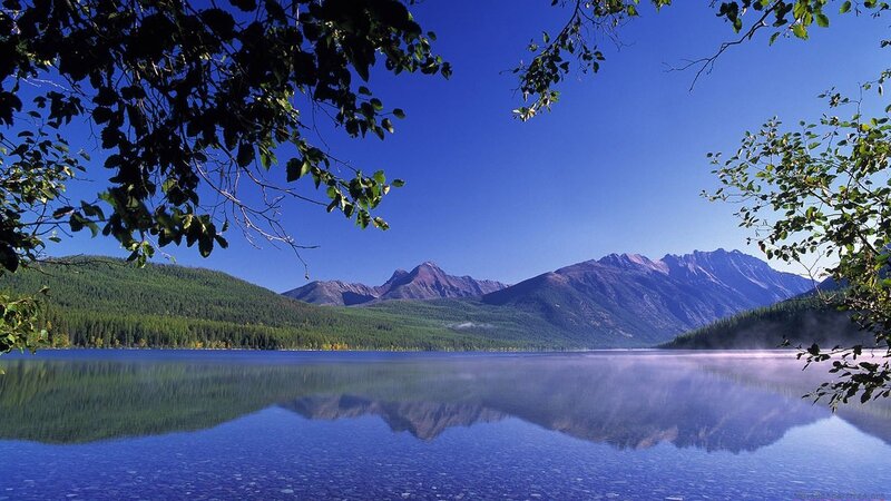 Mountain lake with forest reflection