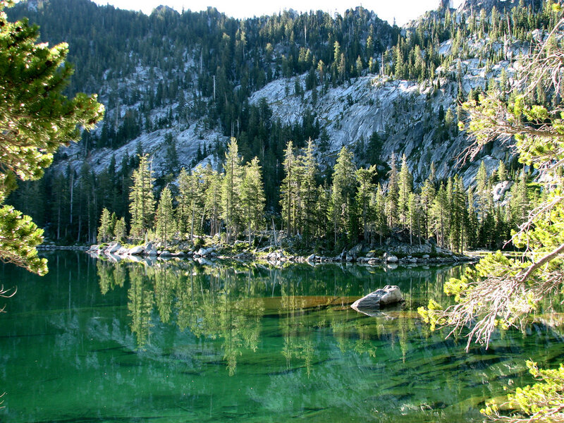 Mountain lake with forest reflection