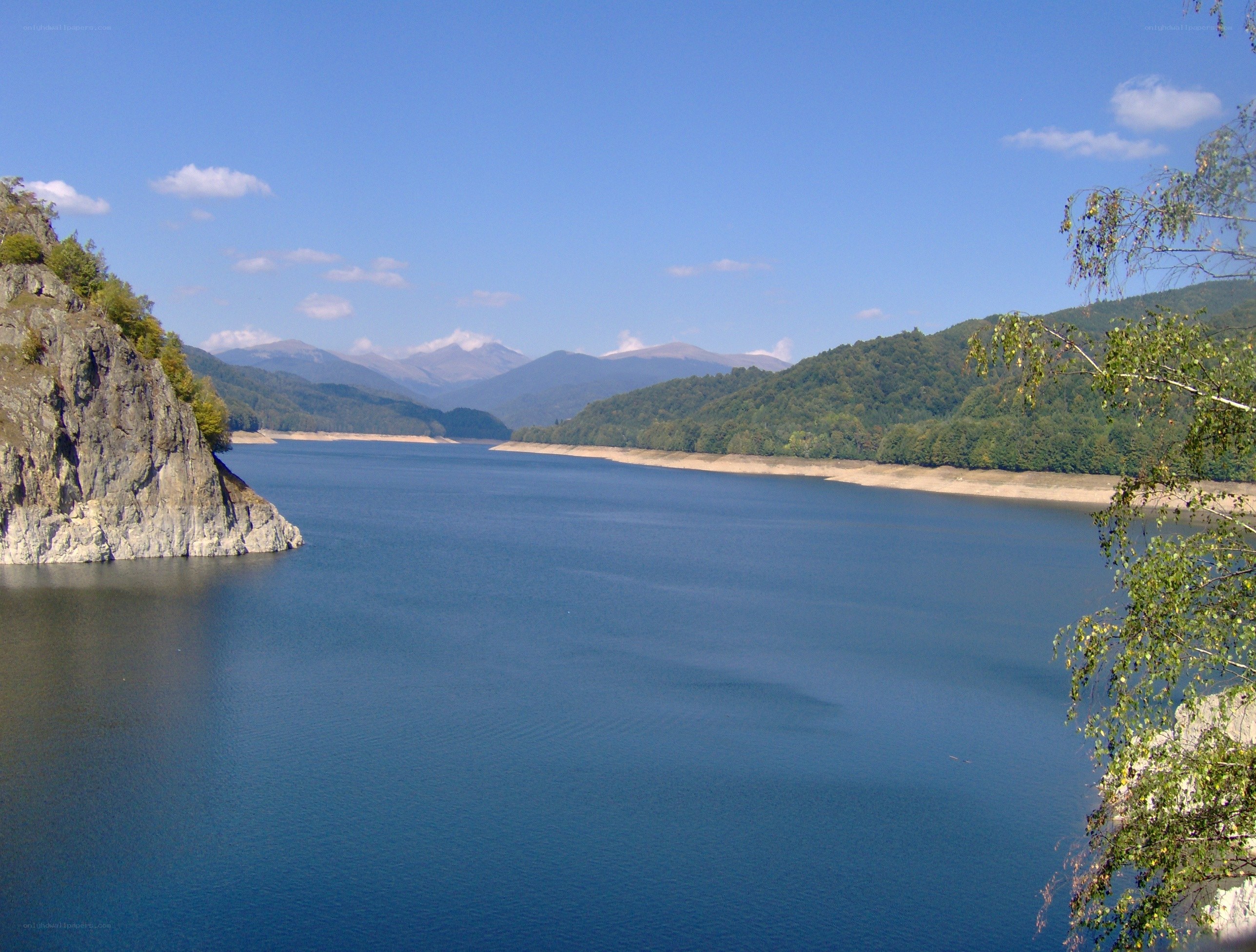 Mountain lake with forested hills