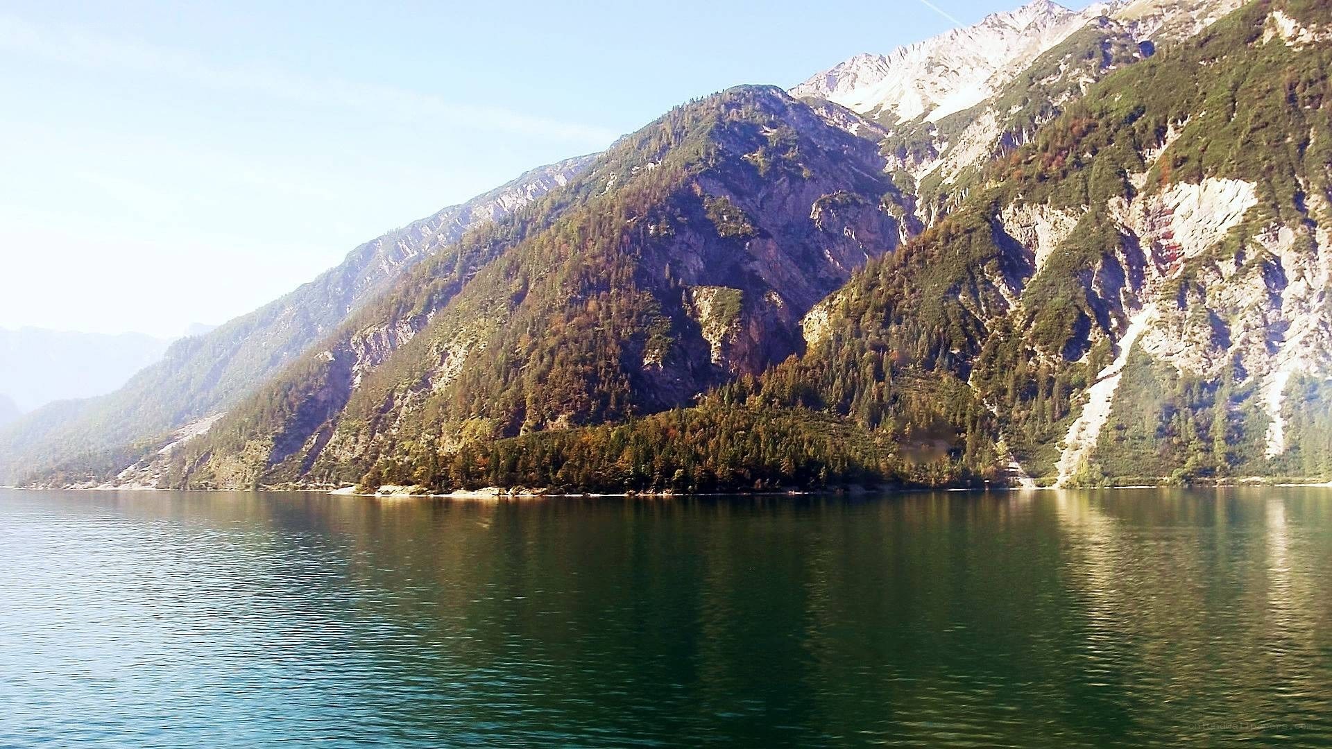 Mountain lake with forested slopes