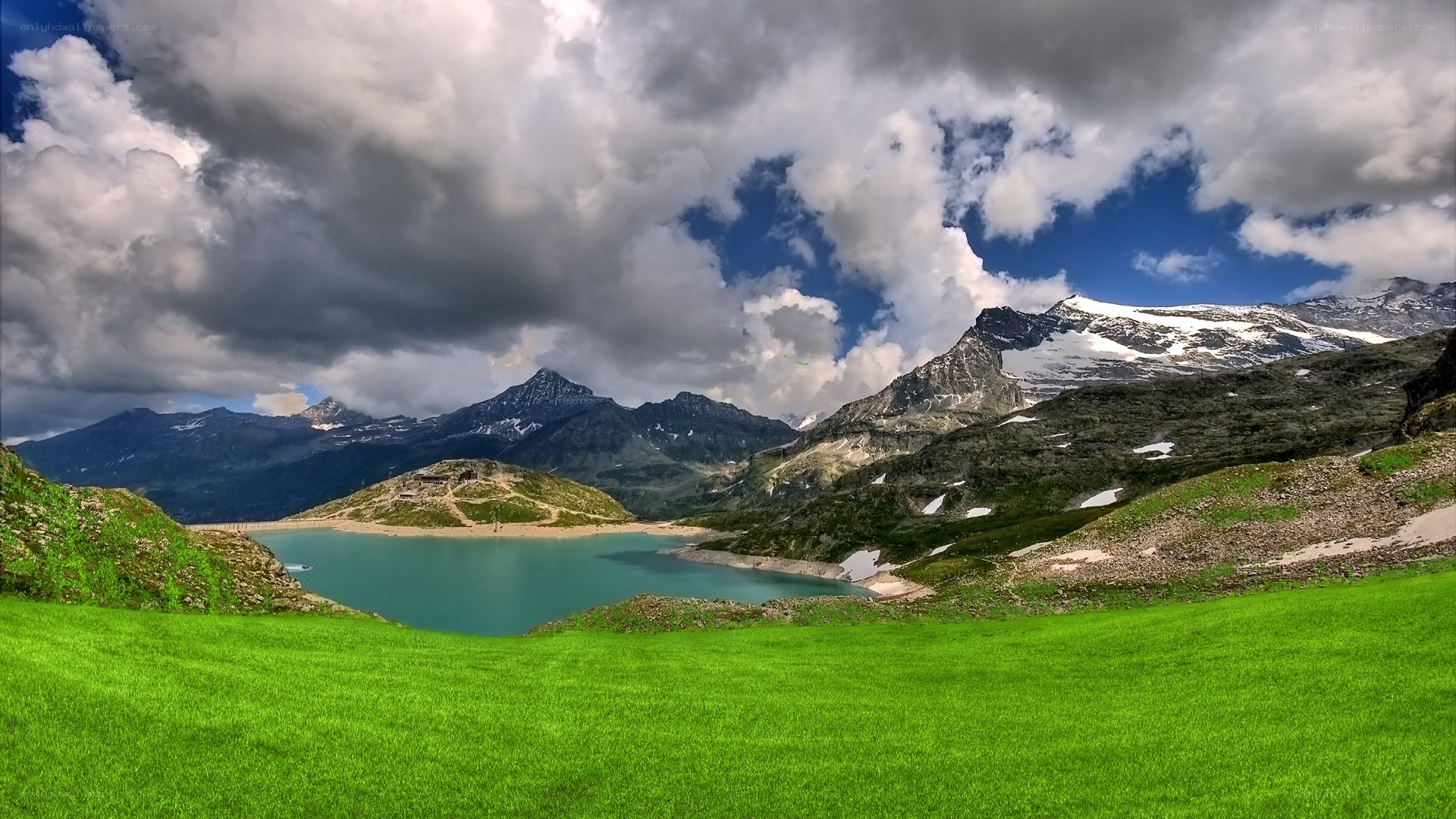 Mountain lake with green grass
