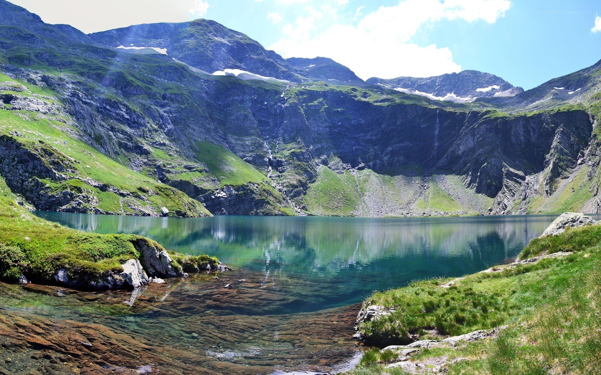 Mountain lake with green hills
