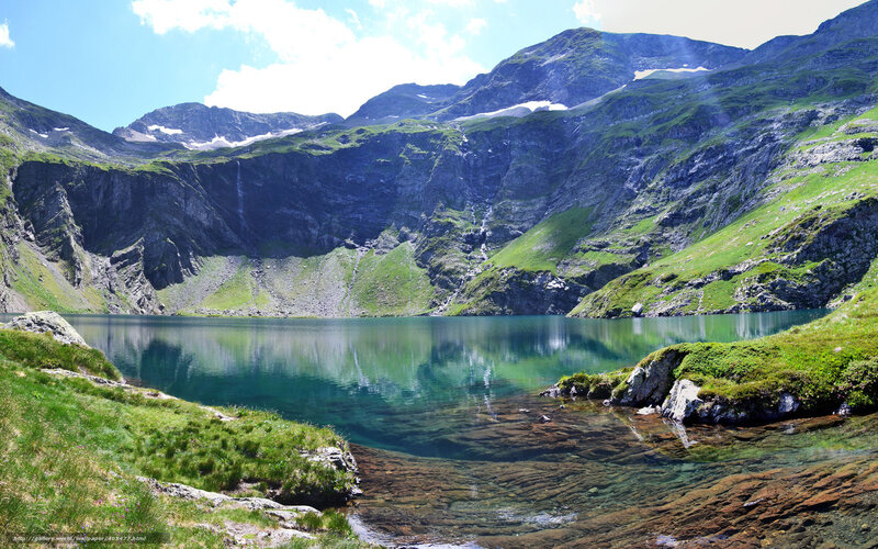 Mountain lake with green hills