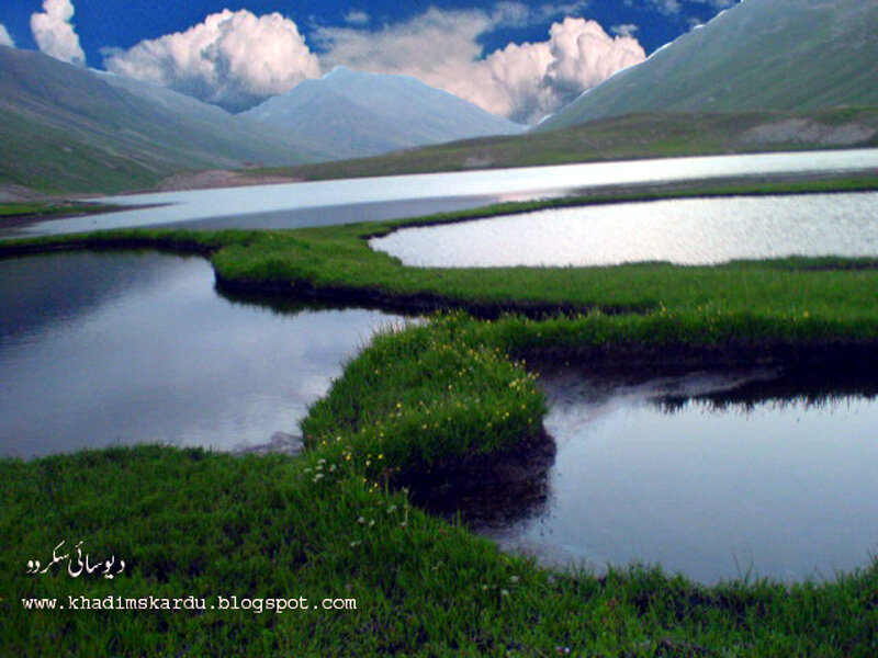 Mountain lake with green islands