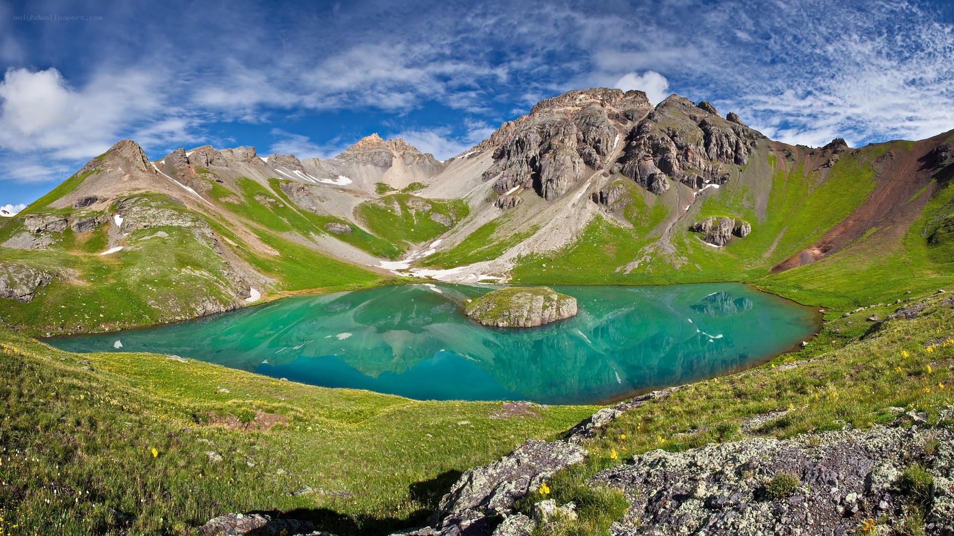 Mountain lake with green waters