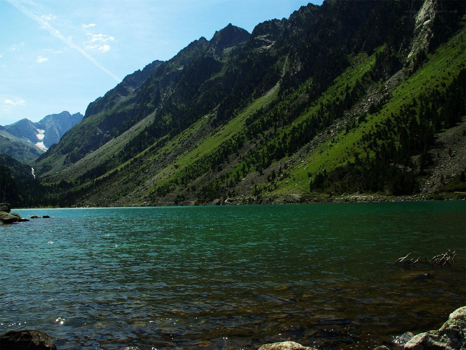 Mountain lake with green waters