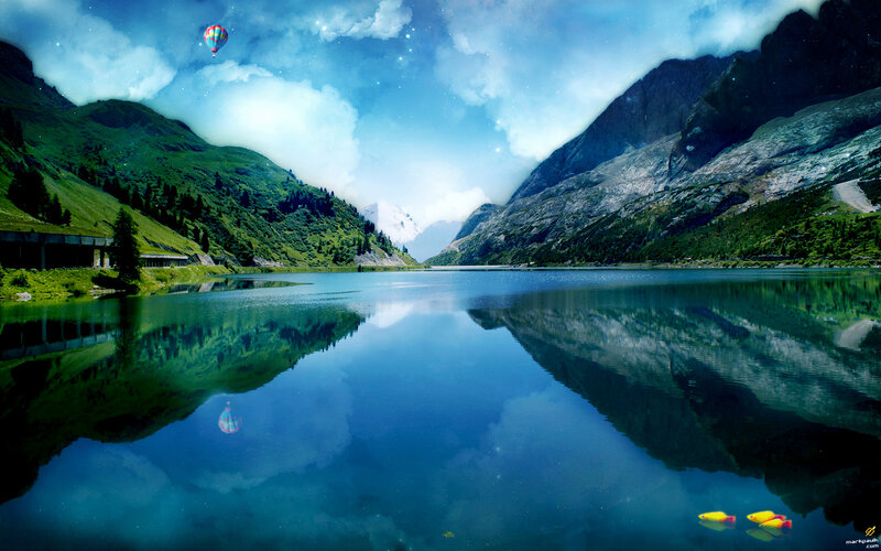 Mountain lake with hot air balloon