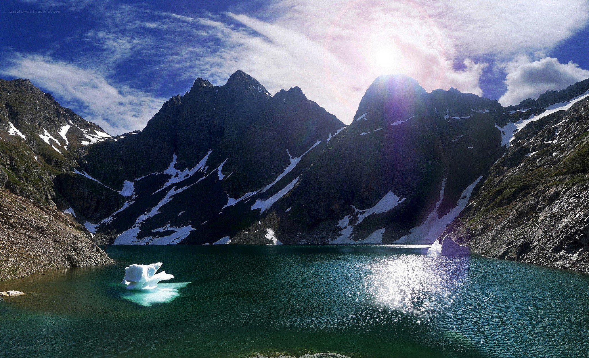 Mountain lake with icebergs