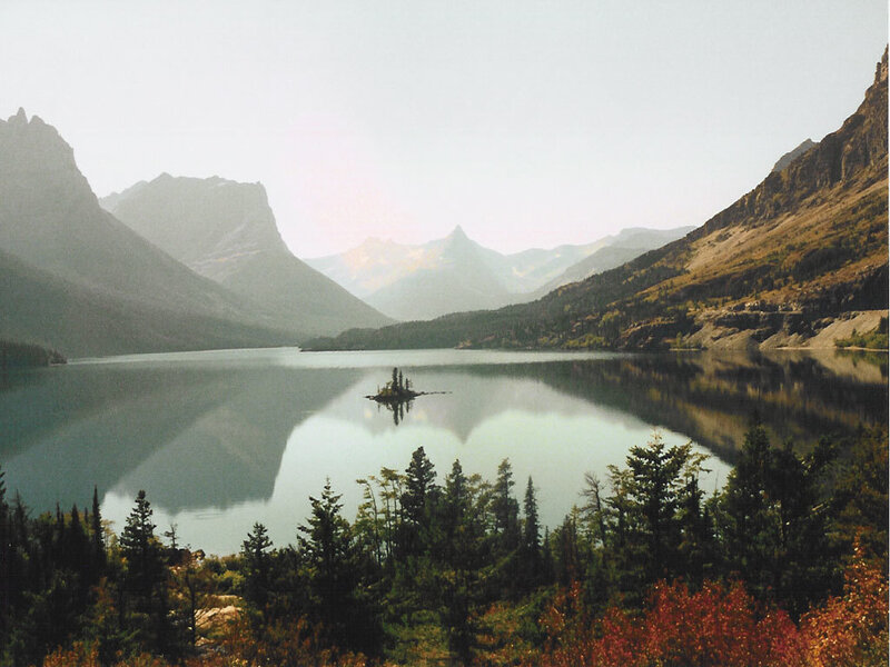 Mountain lake with island reflection