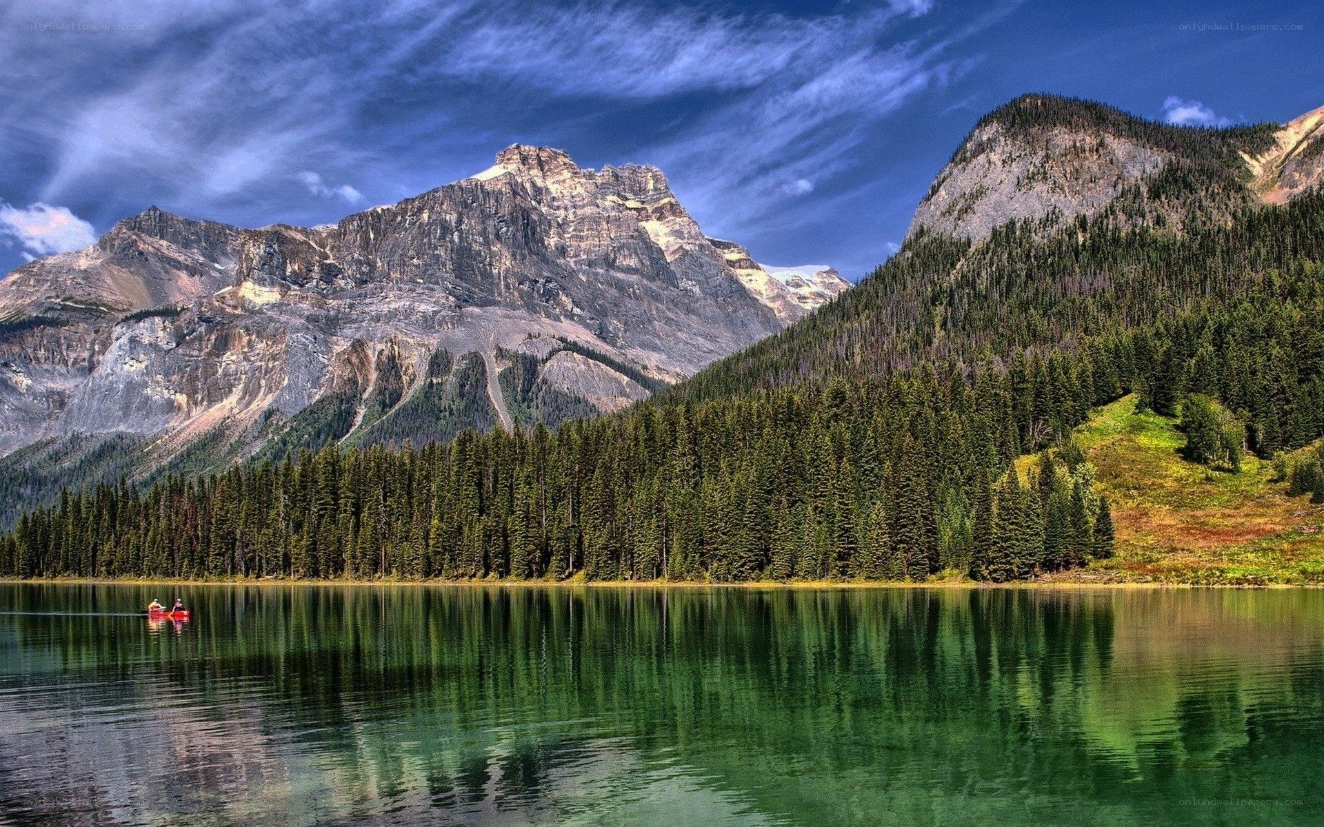 Mountain lake with kayakers
