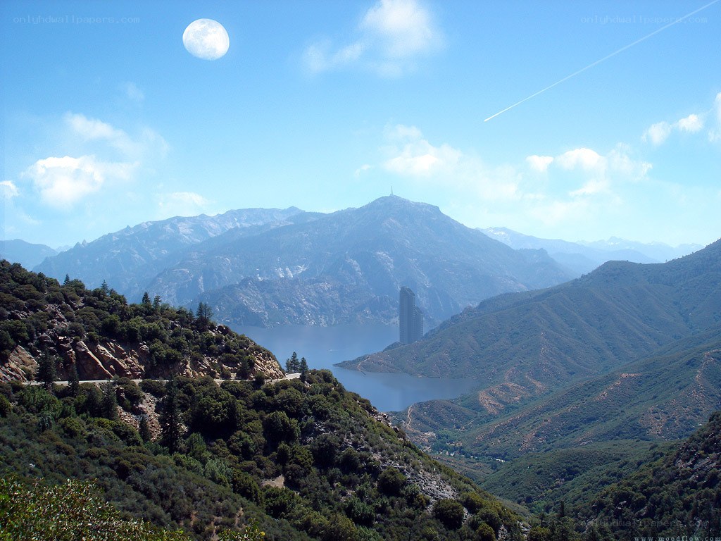 Mountain lake with moon and tower
