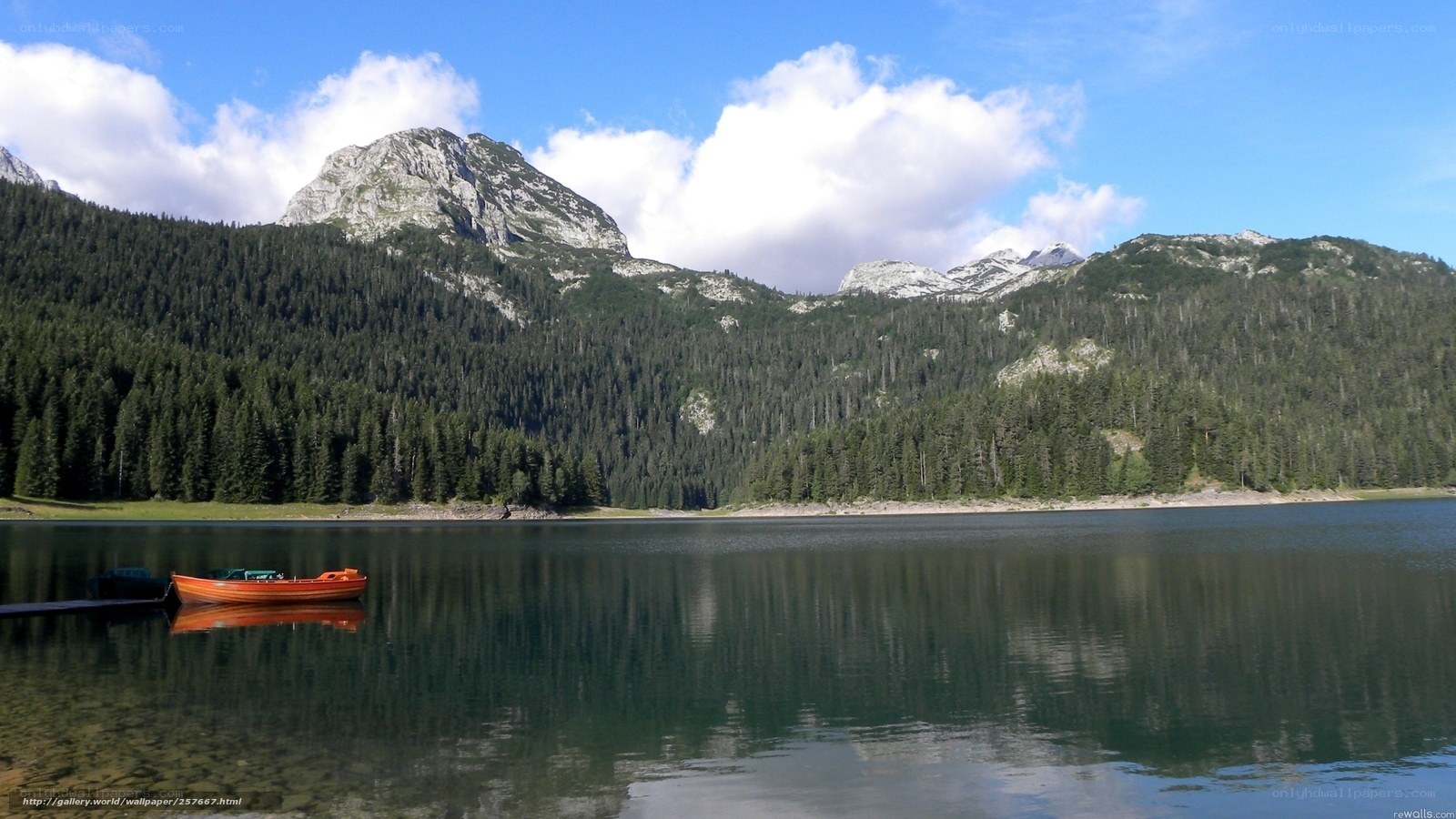 Mountain lake with orange boat