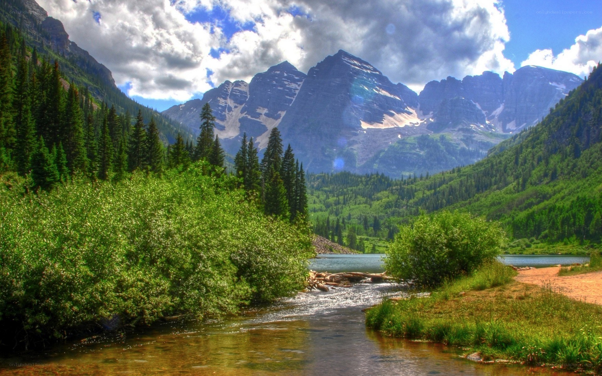 Mountain lake with river and forest
