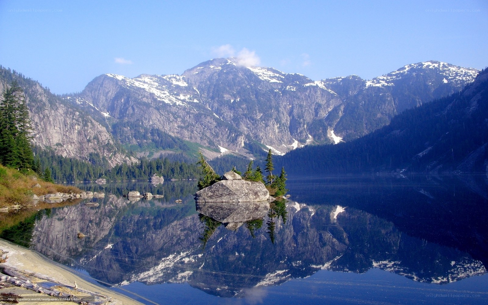 Mountain lake with rock island