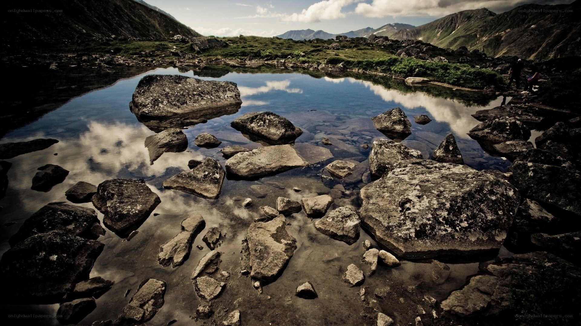 Mountain lake with rock reflections