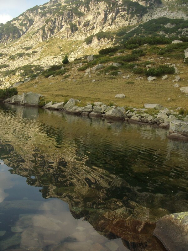 Mountain lake with rocky shore