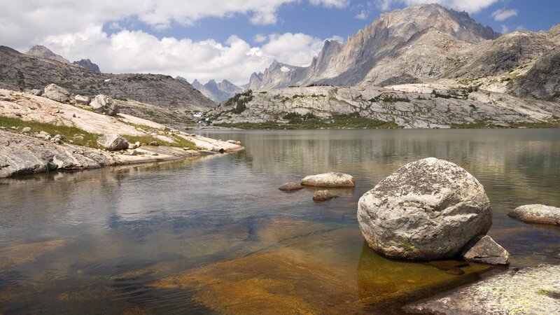 Mountain lake with rocky shore