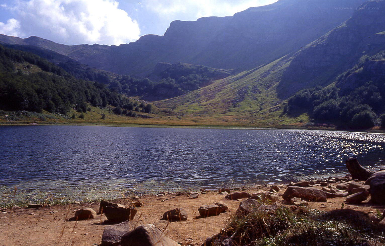Mountain lake with rocky shore