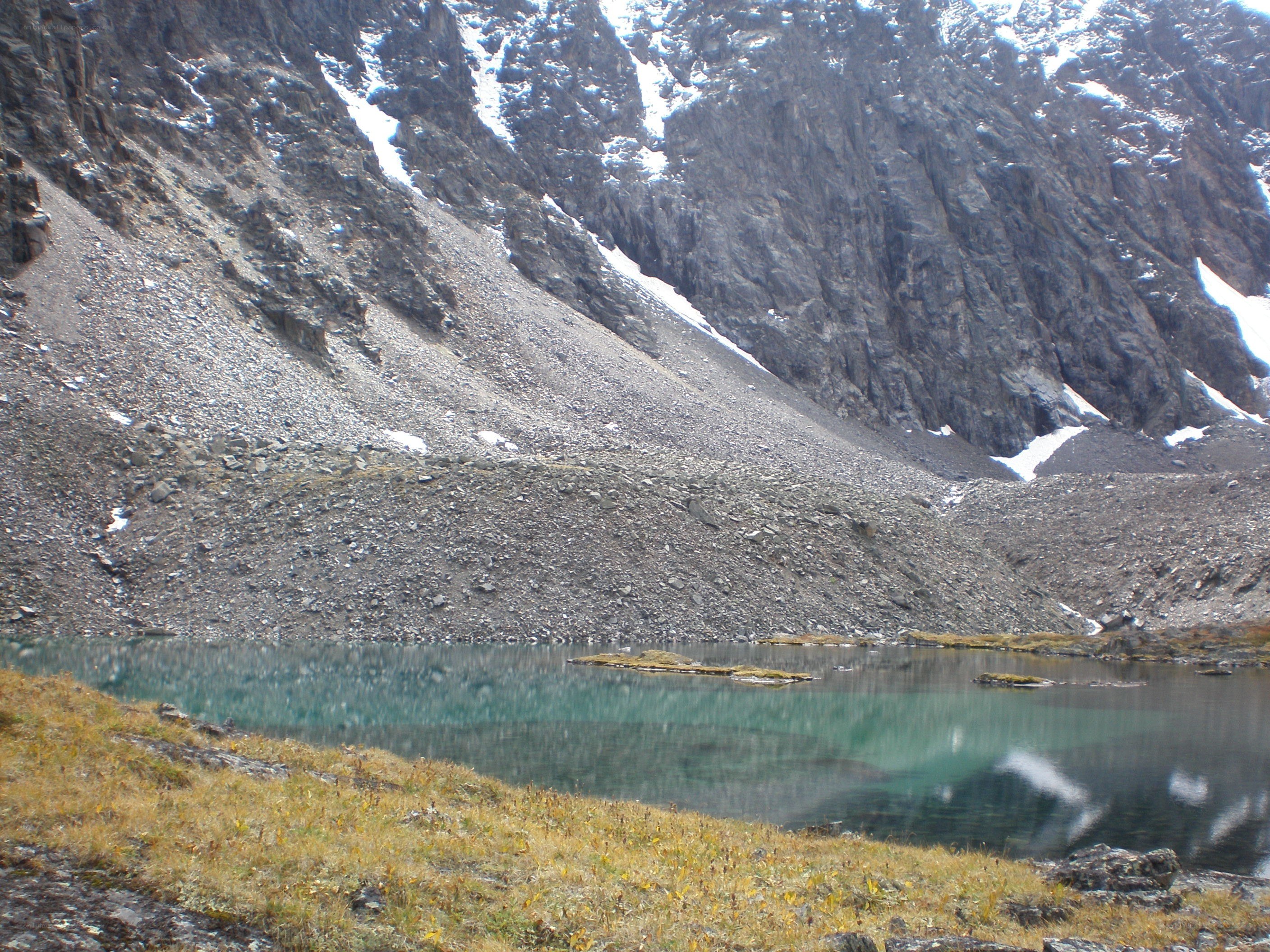 Mountain lake with rocky slopes