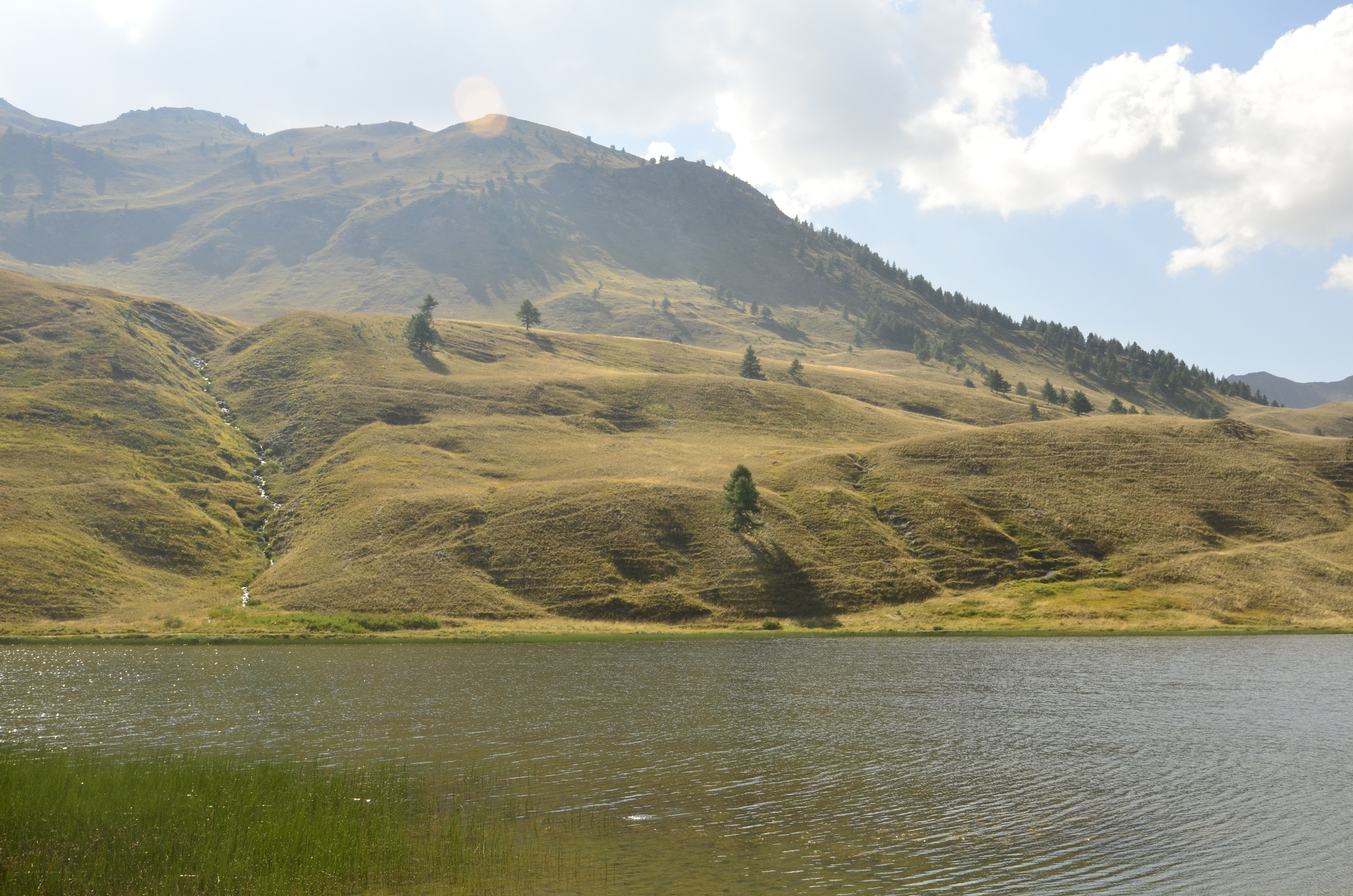 Mountain lake with rolling hills