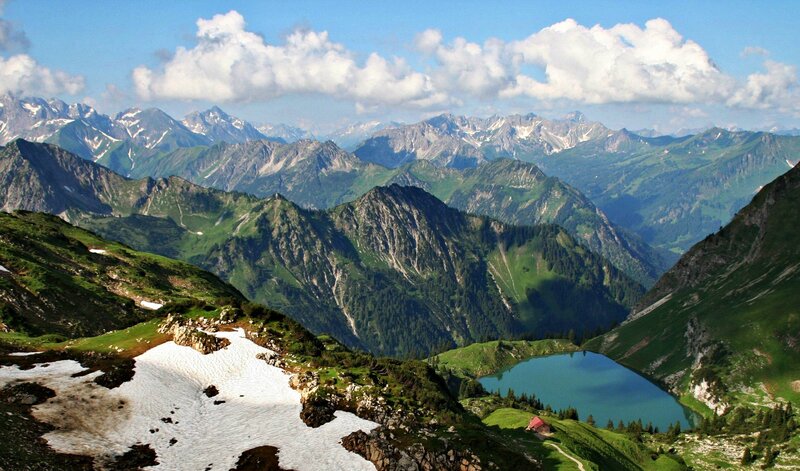 Mountain lake with snow and peaks