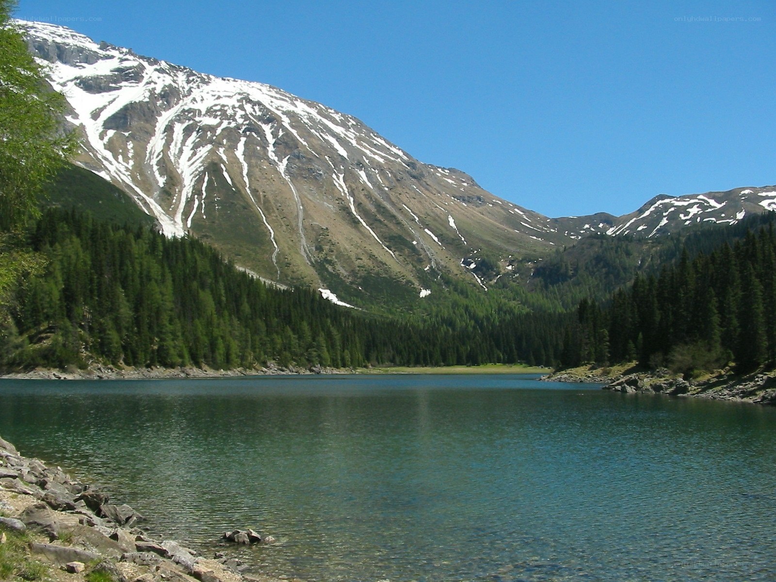 Mountain lake with snow-capped peaks