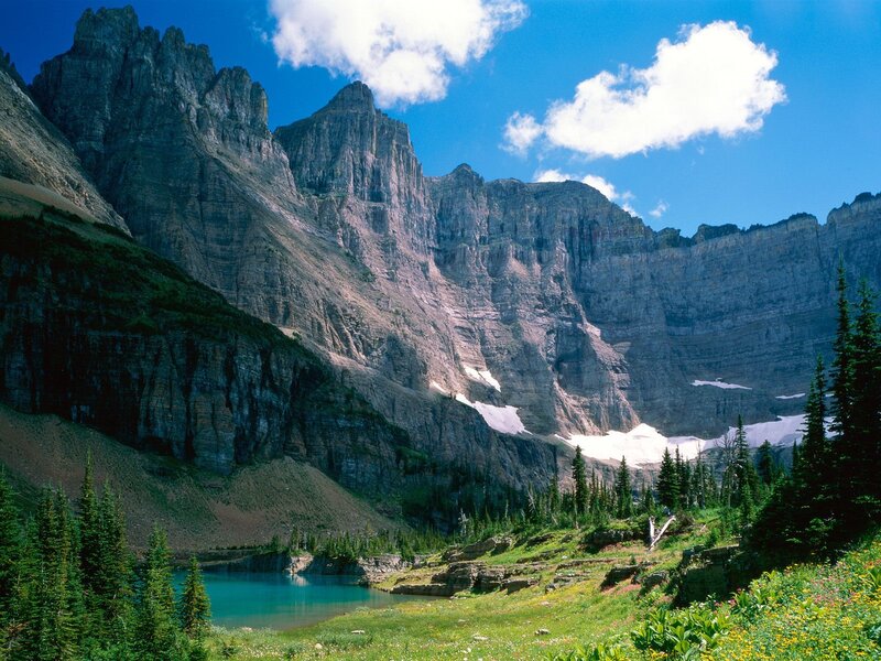 Mountain lake with snow patches