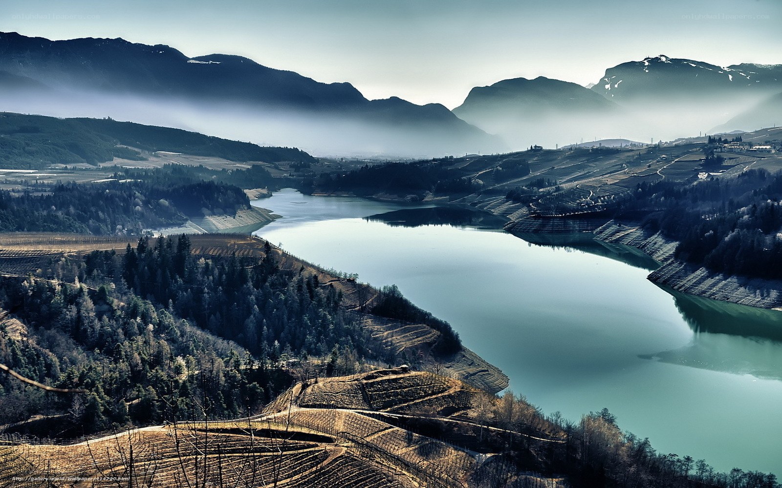 Mountain lake with terraced hills