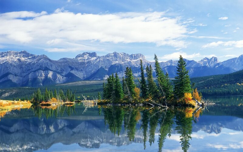 Mountain lake with tree reflection
