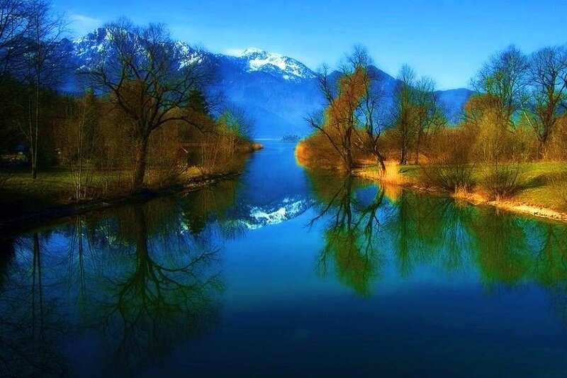 Mountain lake with tree reflections