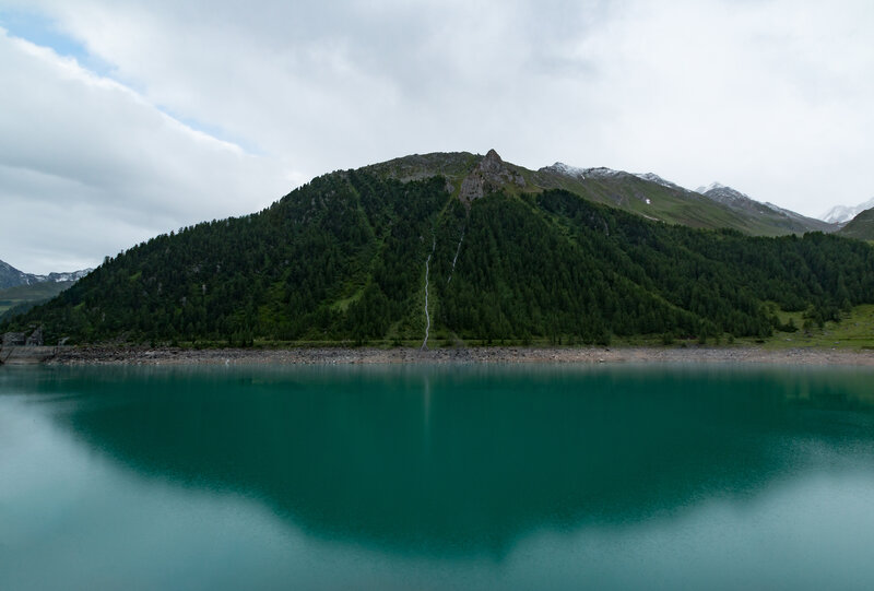 Mountain lake with waterfall
