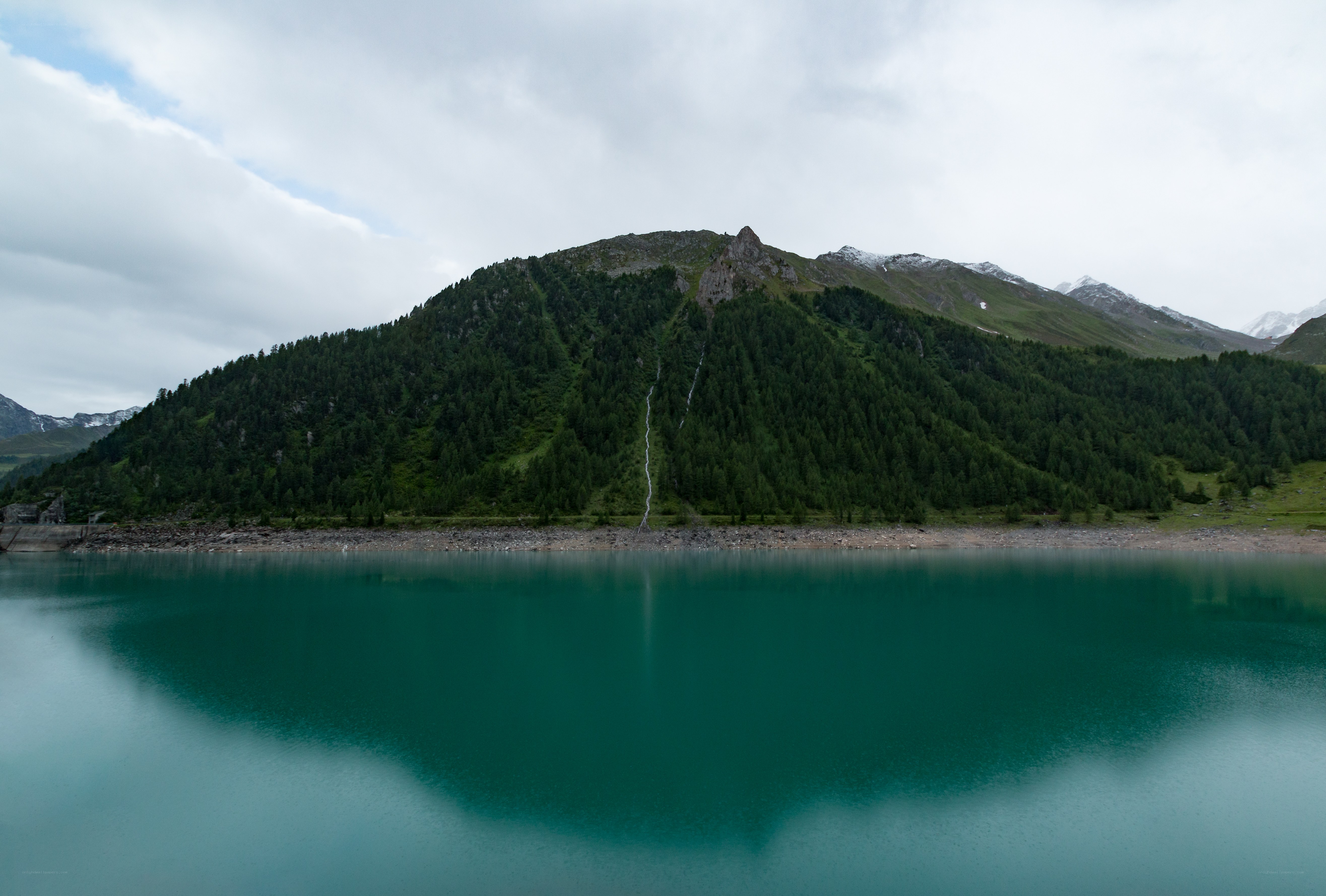 Mountain lake with waterfall