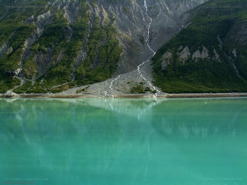 Mountain lake with waterfall