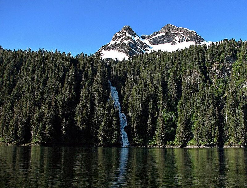 Mountain lake with waterfall
