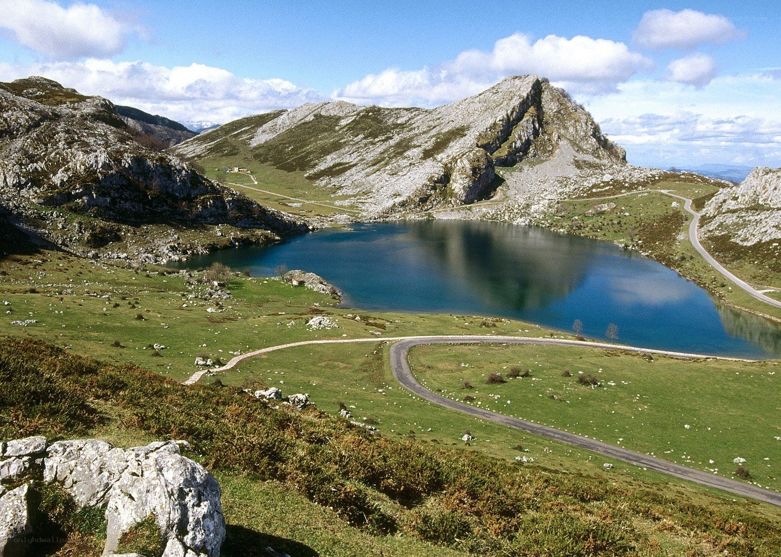 Mountain lake with winding road