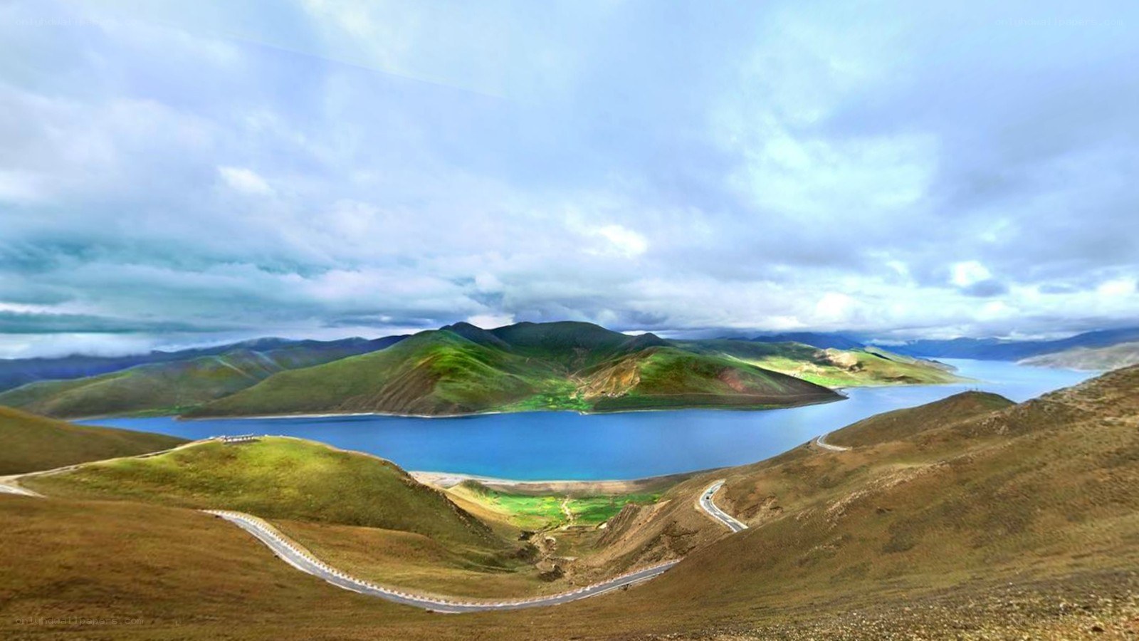 Mountain lake with winding road