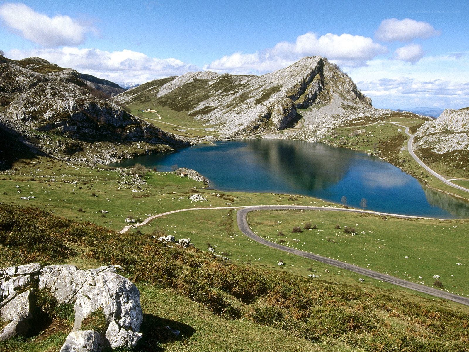 Mountain lake with winding road