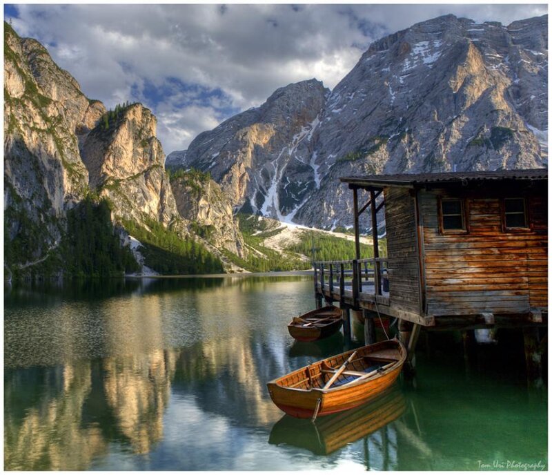 Mountain lake with wooden boats