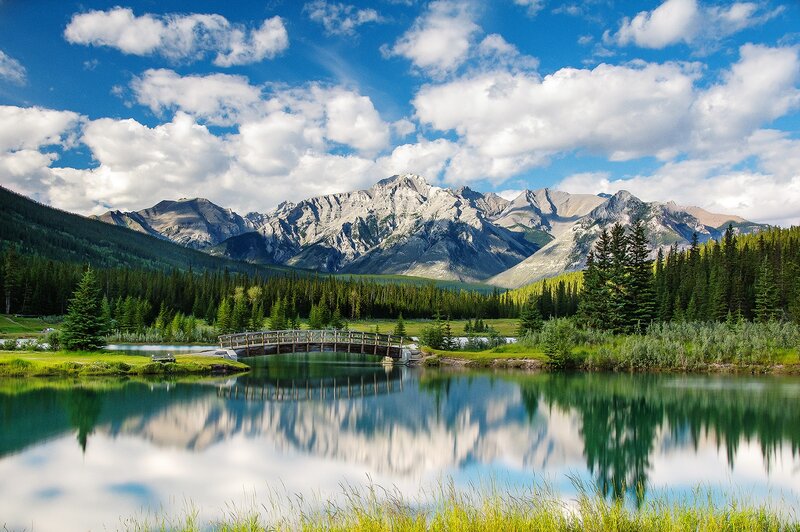 Mountain lake with wooden bridge