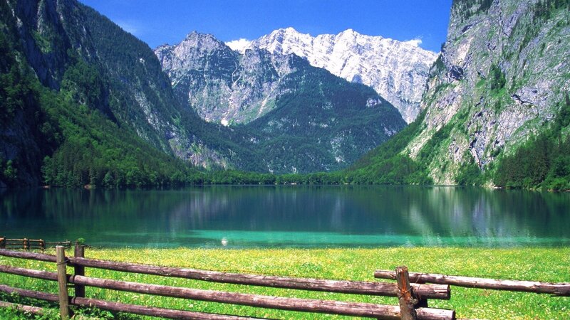 Mountain lake with wooden fence
