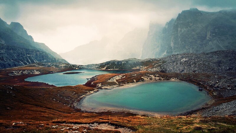 Mountain lakes in misty valley