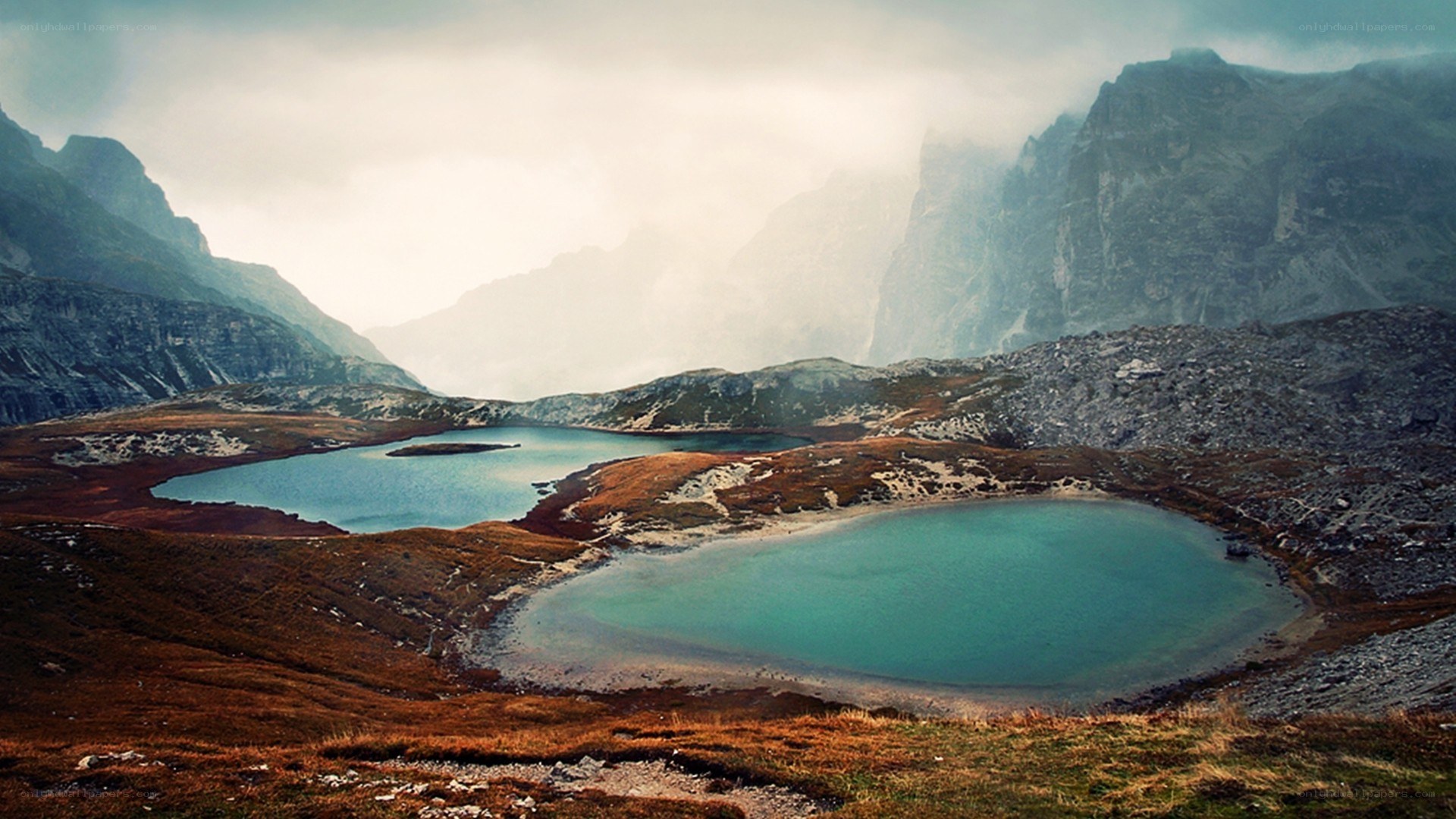 Mountain lakes in misty valley