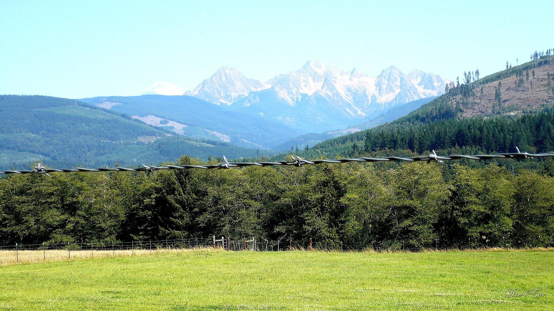 Mountain landscape with barbed wire