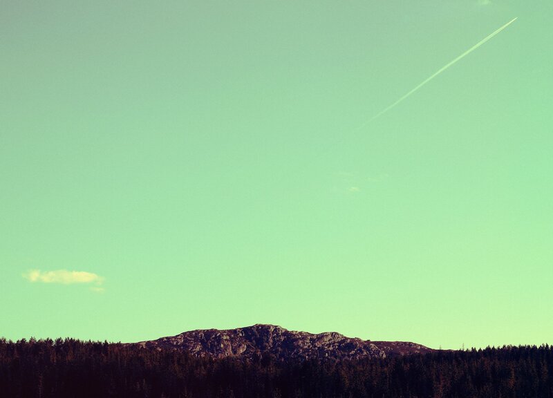 Mountain landscape with contrail