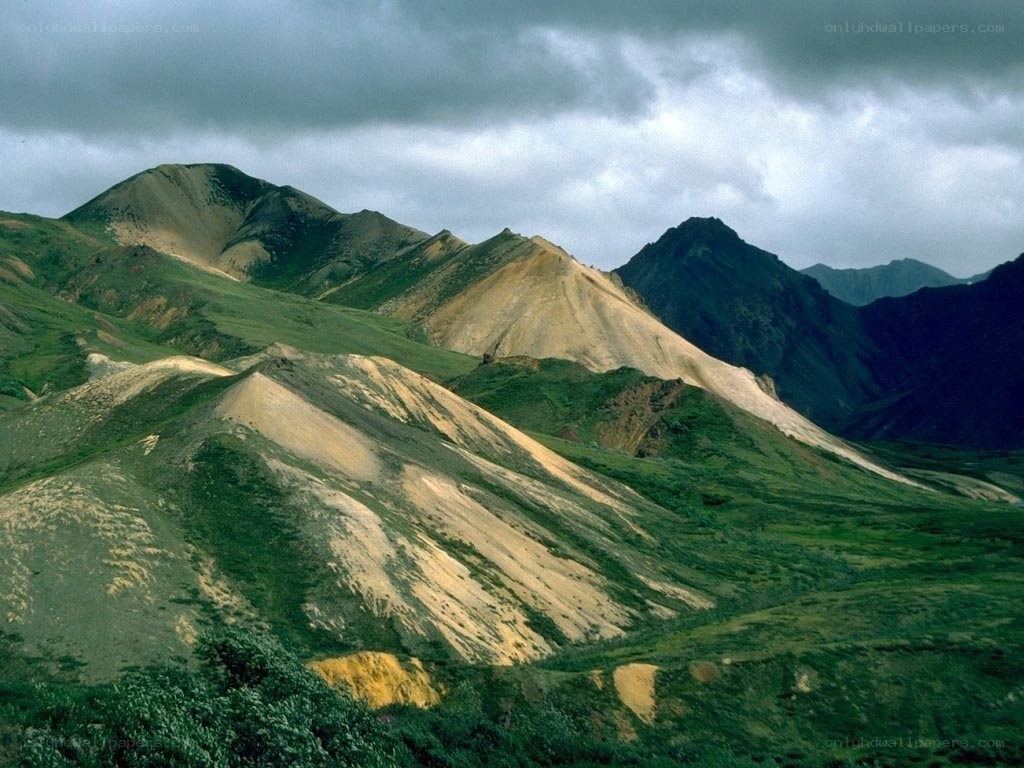 Mountain landscape with green and brown slopes