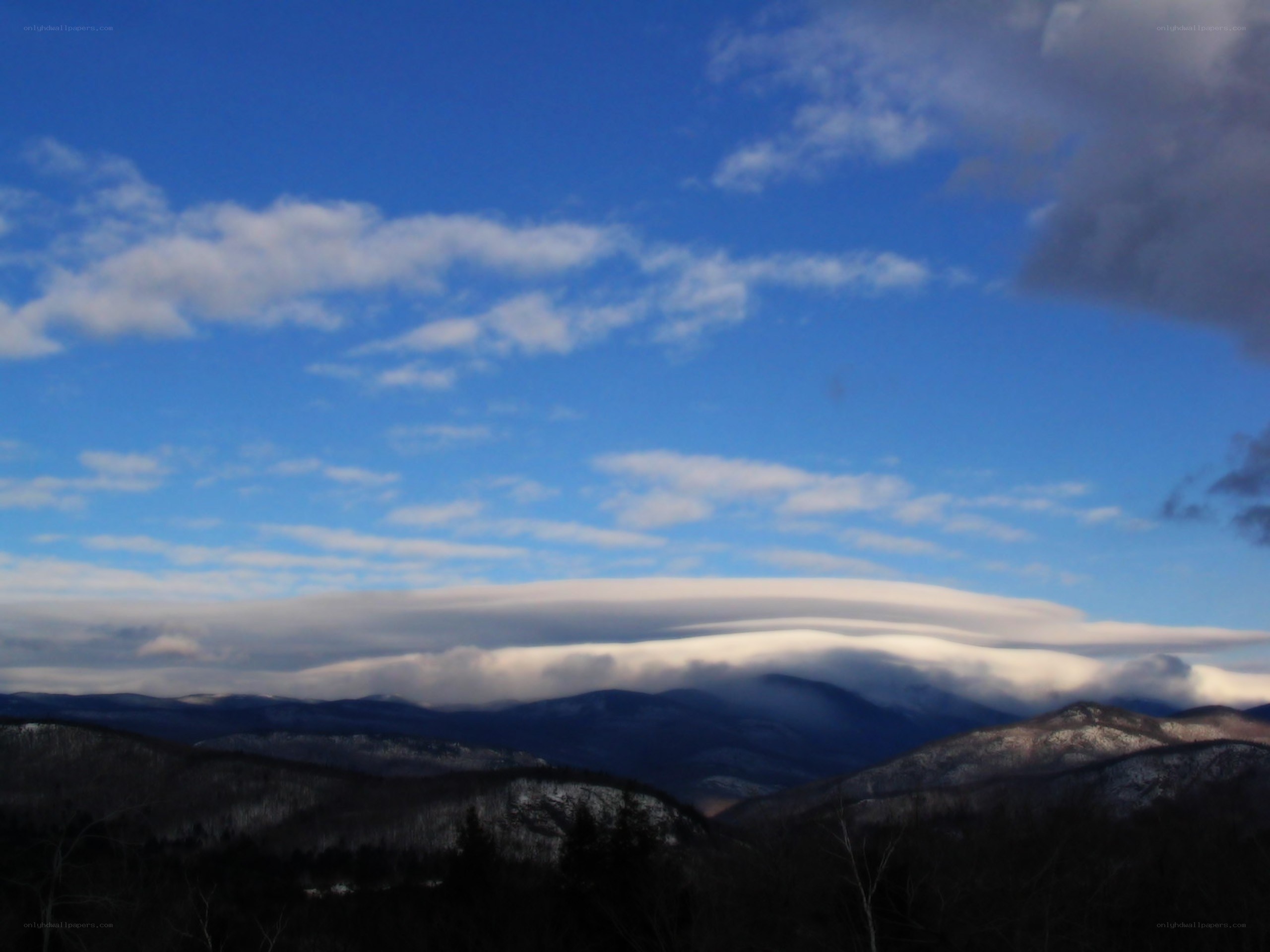 Mountain landscape with lenticular clouds