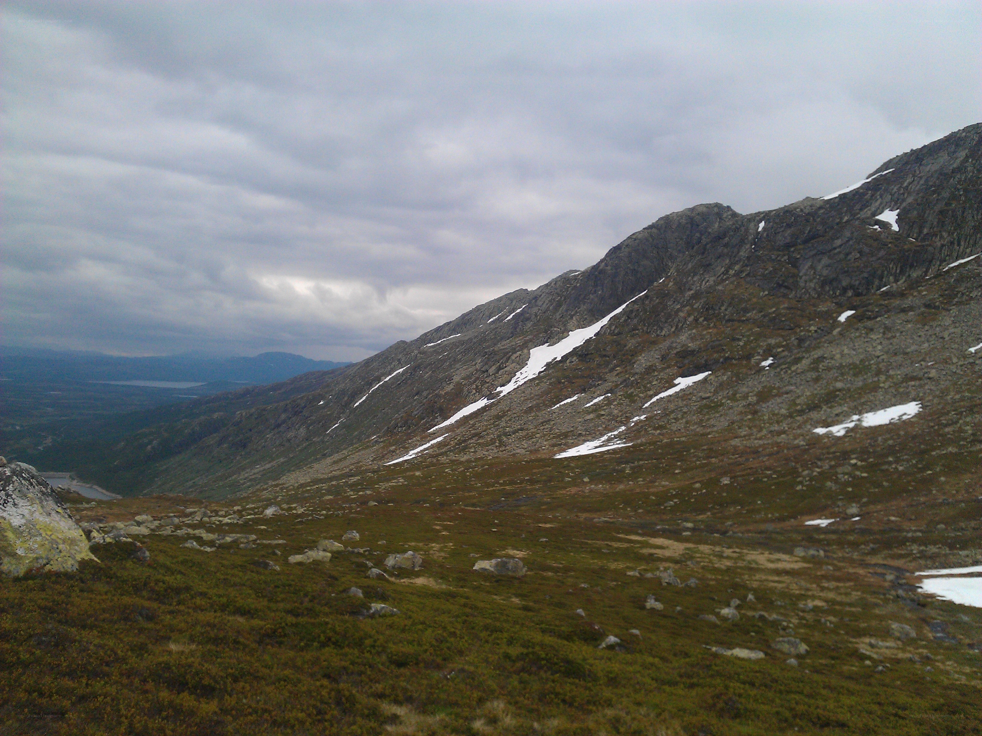 mountain landscape with snow patches