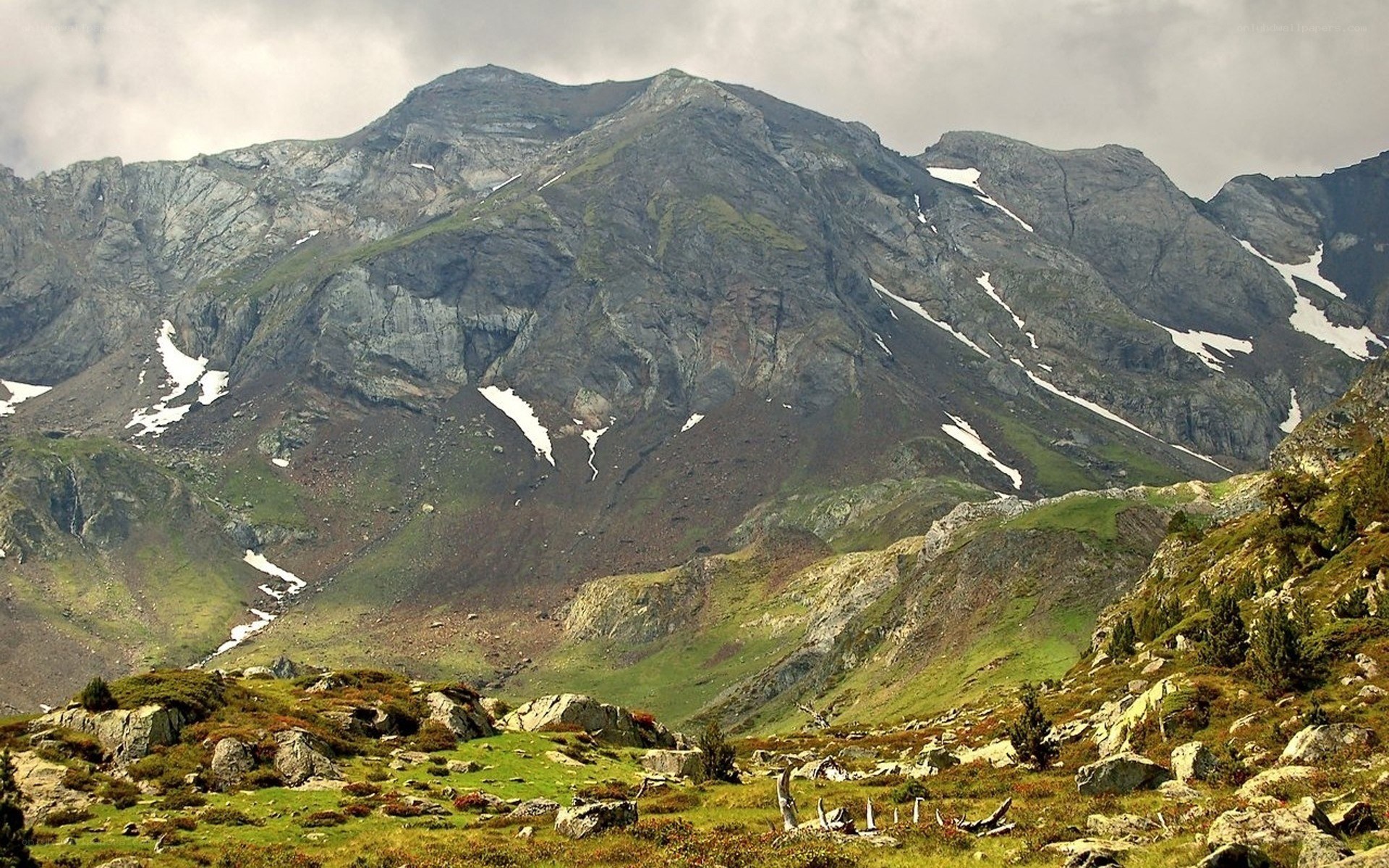 Mountain landscape with snow patches