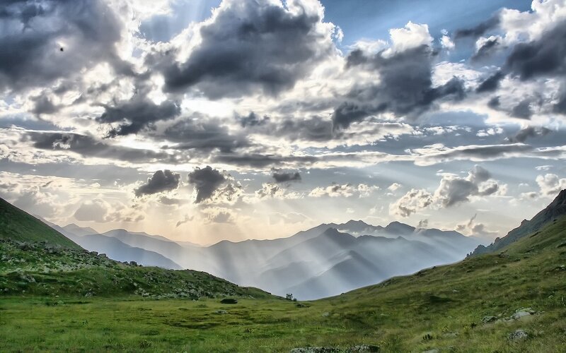 Mountain landscape with sun rays