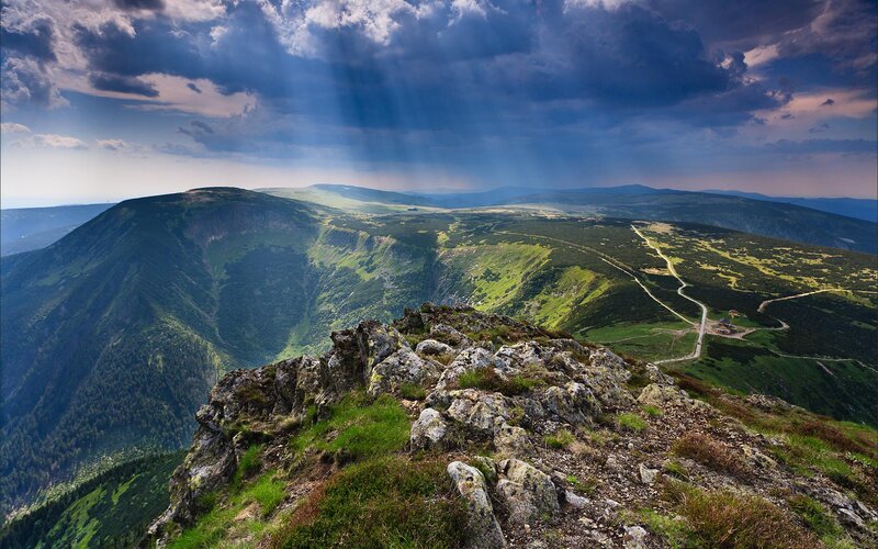 Mountain landscape with sunbeams